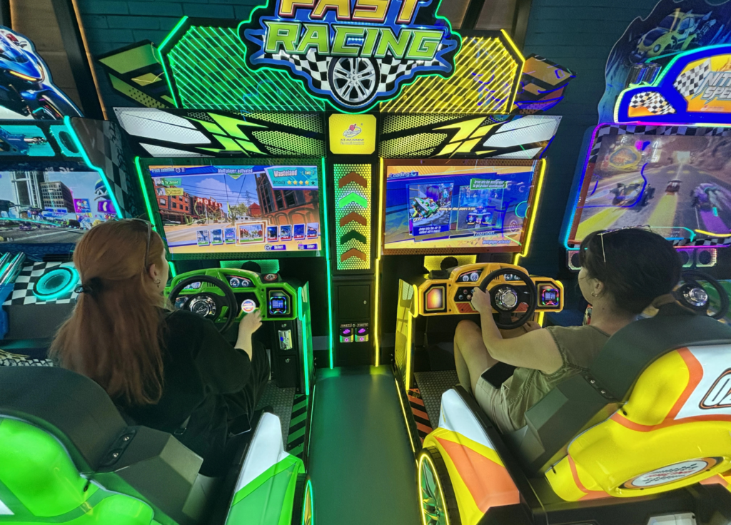 Mobile game development team playing arcade